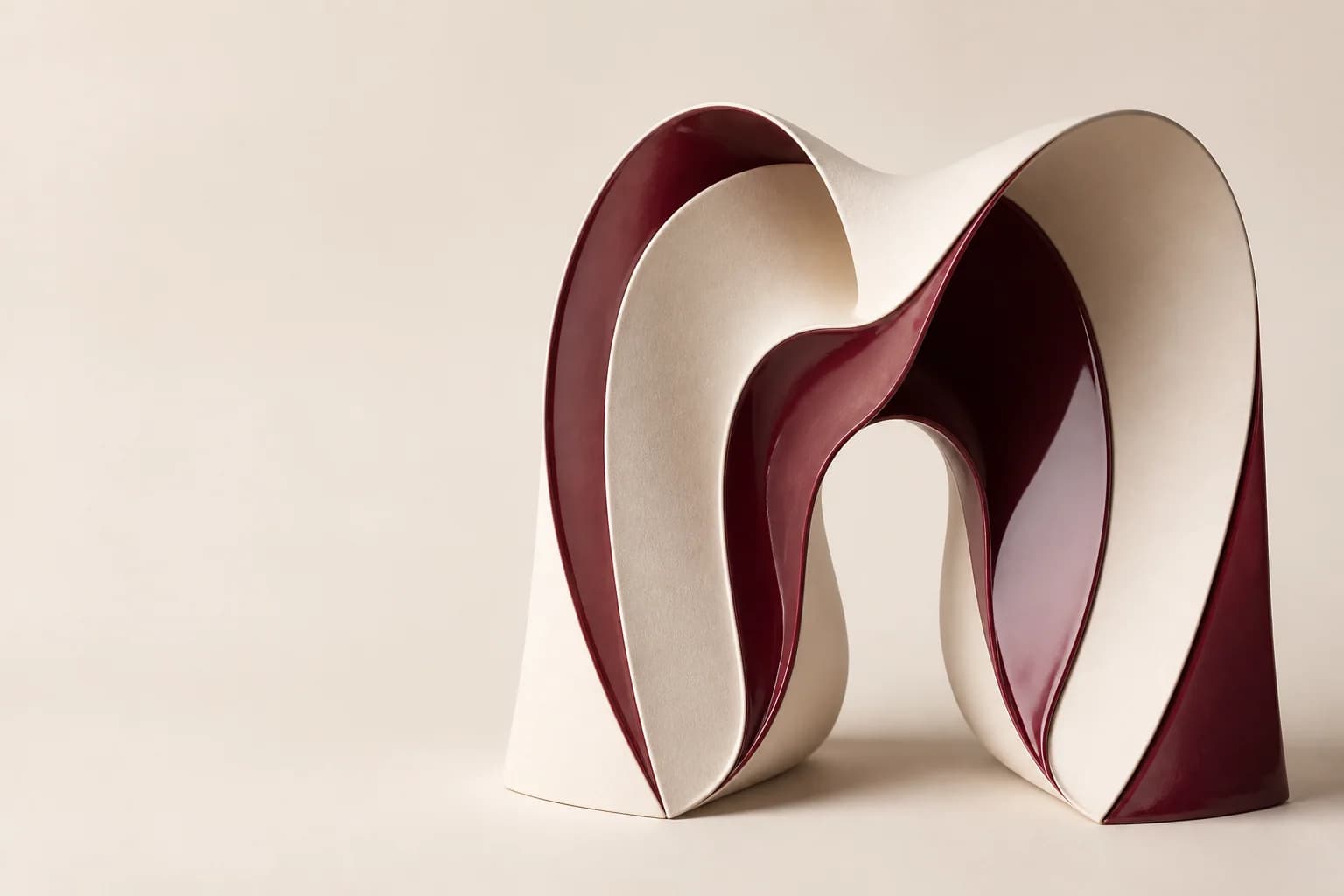 Abstract maroon and ivory folded sculpture